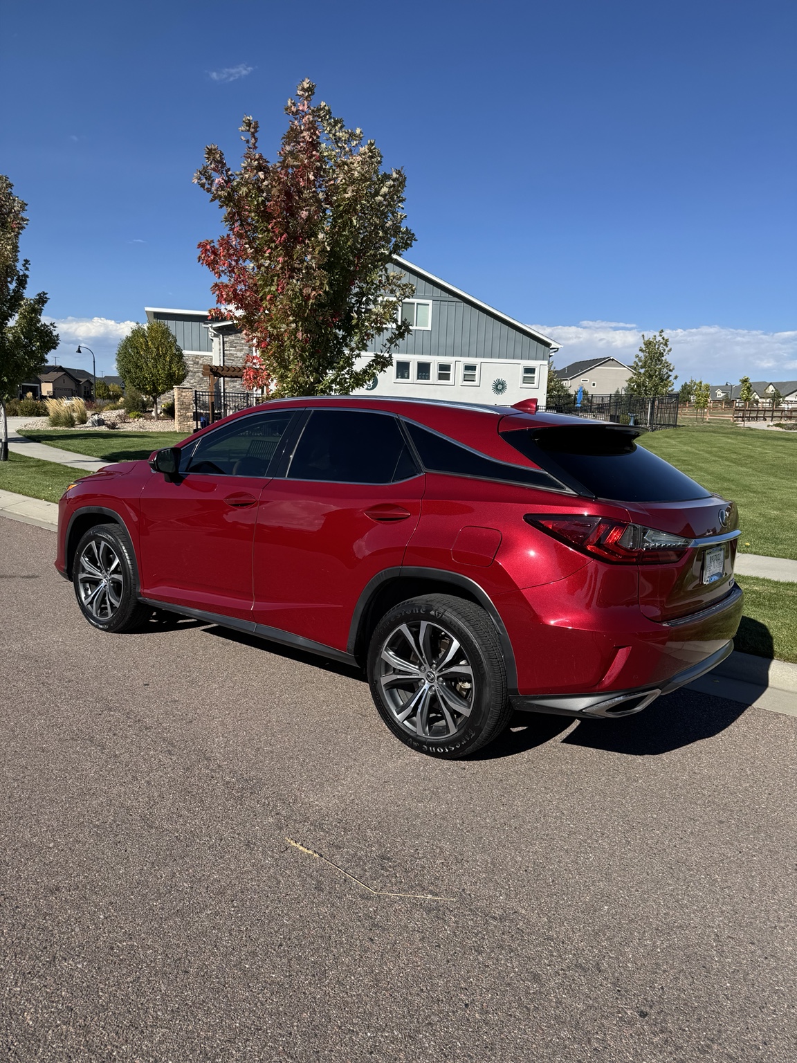 Rear three-quarter view of the red 2019 Lexus RX 350
